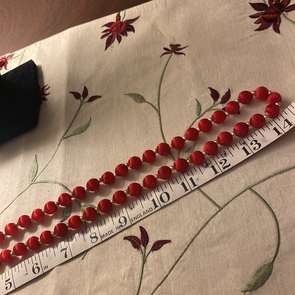 Red fabric covered beaded necklace. Tiny silver beads between the red. - Picture 3 of 3